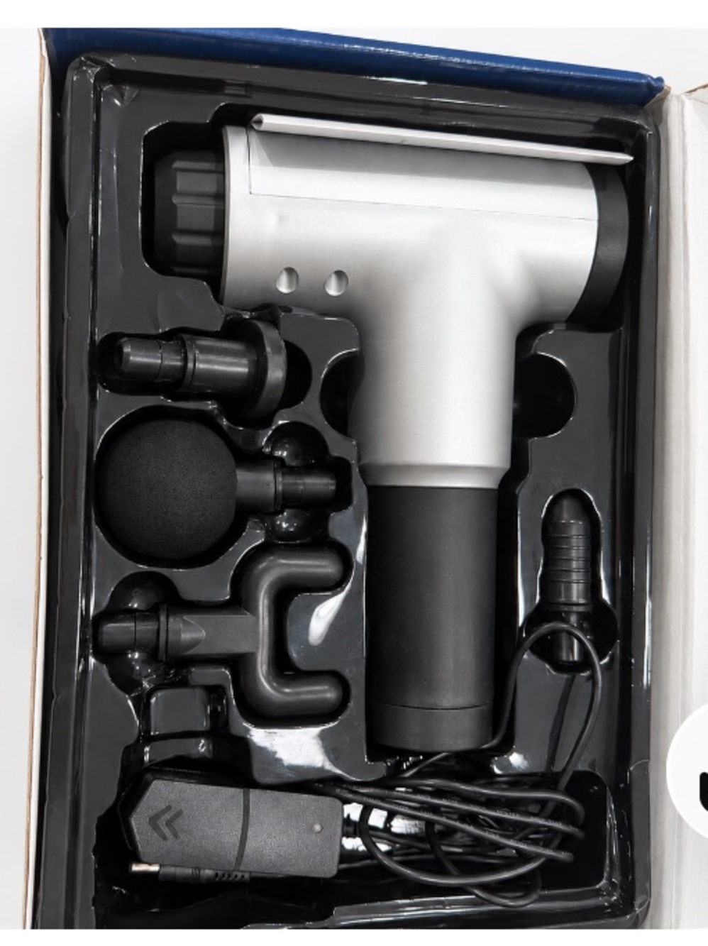 Portable Silver & Black Massage Gun with Multiple Attachments